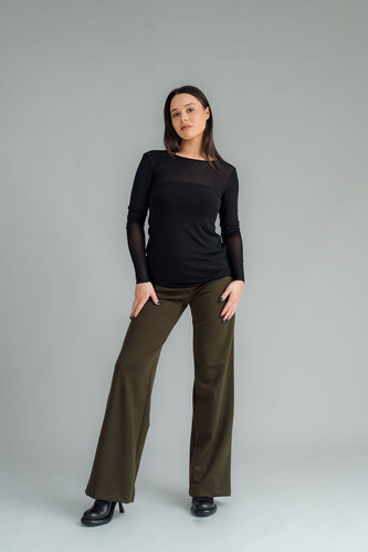 the Famous NES Dolly Bird Pants are back and better than ever! These wide-leg pants feature a versatile fold-down waistband that can be worn up or folded for a customizable fit. Whether you’re dressing up or down, these pants will quickly become your go-to wardrobe staple for years to come. Available in two lengths: Ponte Viscose poly spandex
