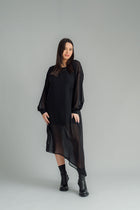The NES Glide Dress is inspired by our best-selling NES Flow Dress, now with long sleeves for added warmth and versatility. This multi-seasonal dress is perfect for both casual and formal occasions, offering endless styling options. Wear it draped down the front for a relaxed look, or cinch it up at the side with the adjustable side button and hem loopers for a more defined shape. The long sleeves feature elasticated loopers and a metal shank cuff button for added detail. Style it with our Lattice Slip