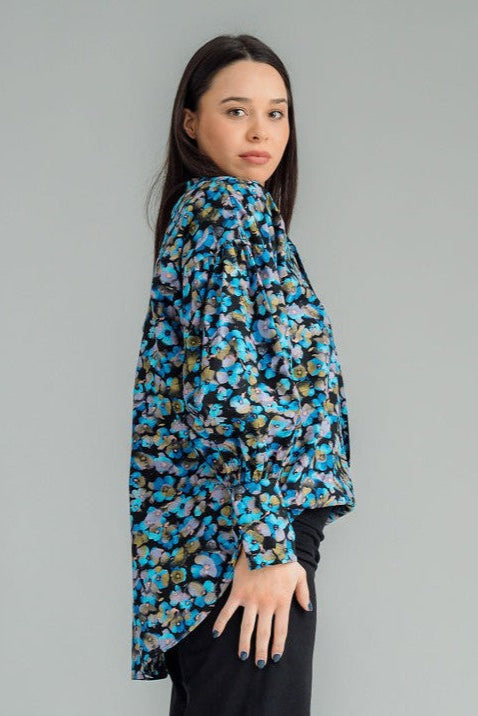  NES Mia Shirt is your ultimate go-to for effortless style. Featuring a drawcord neck that can be adjusted for a tighter fit, this shirt offers both versatility and comfort. The wide traditional cuff detail with a single metal shank button and elastic looper adds a stylish touch of refinement. This trans-seasonal piece is perfect for layering, making it easy to dress up or down depending on the occasion. 
