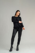 Load image into Gallery viewer, NES Merino LEISURE Top is a versatile piece, perfect for pairing with your favourite denim, Dolly B pants, Drilled Gin pants, or the Ribs skirt. This top features a self-tie at the side that can be adjusted to your liking—tied tight for a more structured look or looped loose for a relaxed feel. With its batwing design and cigarette sleeves, it offers a flattering silhouette that adds slimness to your lower arms while providing maximum comfort. 100% MERINO
