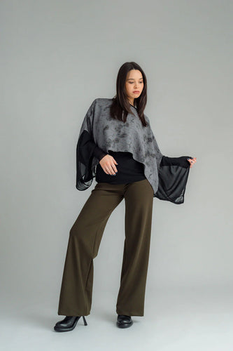 the Famous NES Dolly Bird Pants are back and better than ever! These wide-leg pants feature a versatile fold-down waistband that can be worn up or folded for a customizable fit. Whether you’re dressing up or down, these pants will quickly become your go-to wardrobe staple for years to come. Available in two lengths: