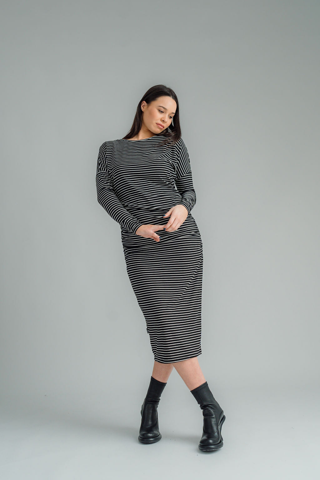 NES, Studio 54 Dress. Batwing sleeves that taper into sleek cigarette cuffs, side seam ruching, and a centre back split. Made from a stretchy knit, it offers a flattering fit that moves with you. Composition: viscose spandex