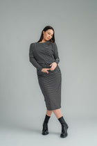 NES, Studio 54 Dress. Batwing sleeves that taper into sleek cigarette cuffs, side seam ruching, and a centre back split. Made from a stretchy knit, it offers a flattering fit that moves with you. Composition: viscose spandex