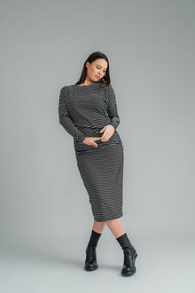 NES, Studio 54 Dress. Batwing sleeves that taper into sleek cigarette cuffs, side seam ruching, and a centre back split. Made from a stretchy knit, it offers a flattering fit that moves with you. Composition: viscose spandex