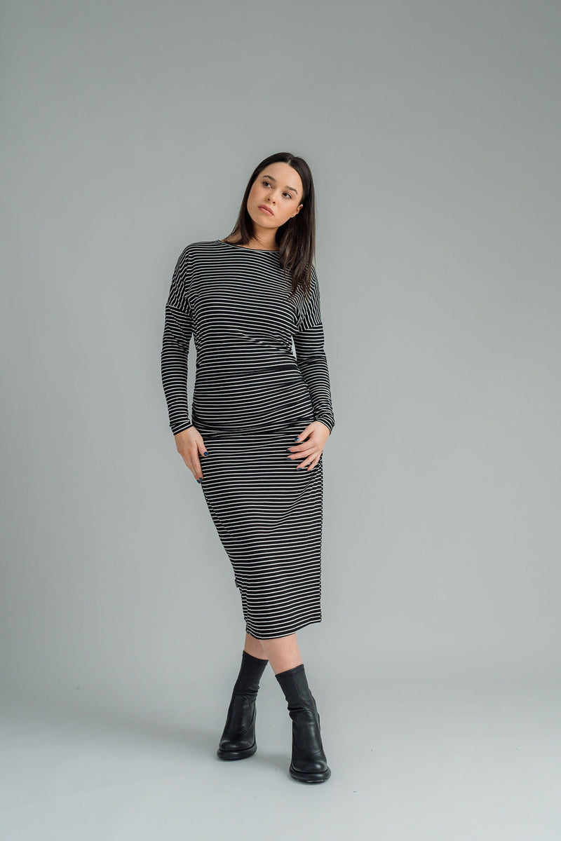 NES, Studio 54 Dress. Batwing sleeves that taper into sleek cigarette cuffs, side seam ruching, and a centre back split. Made from a stretchy knit, it offers a flattering fit that moves with you. Composition: viscose spandex