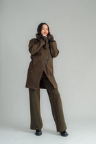 NES Tamara Coat – your ultimate winter companion, designed to elevate both style and comfort. Crafted from a luxurious wool-cashmere blend, this mid-thigh length coat offers the perfect balance of warmth and sophistication. The distinctive angled, exposed contrast black zip adds a modern edge, while the shawl collar gives you versatile styling options. Wear it up and secured with a snap dome for added warmth, or leave it open for a relaxed, draped look across your shoulders