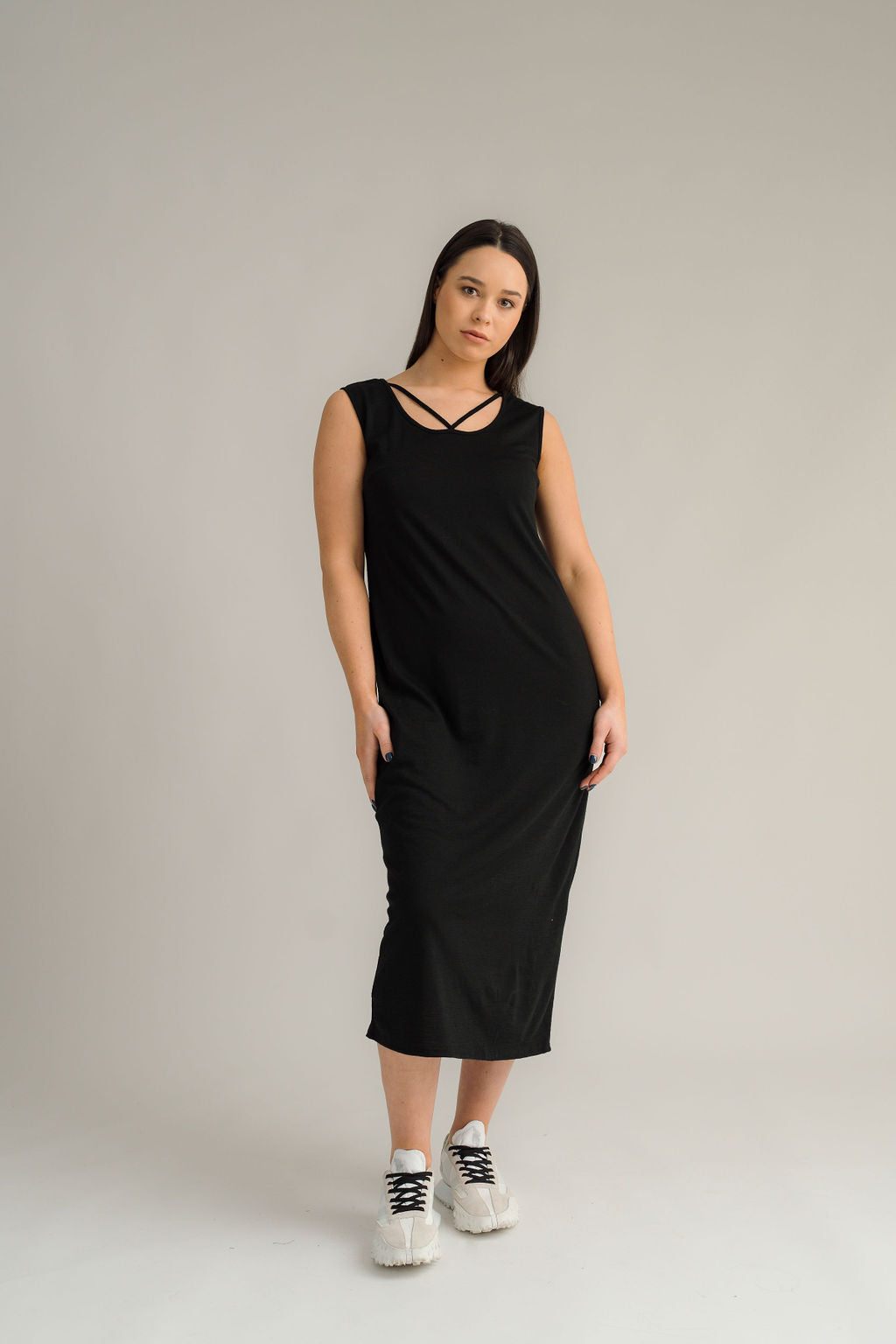 NES Merino Long Lattice Dress is your perfect companion for the cooler months. Made from soft, breathable merino wool, this versatile piece can be worn as a sleek dress or layered as a cozy base. Its relaxed fit through the body and straight hem provide a comfortable yet flattering silhouette, while fine strap detailing adds a touch of elegance. The dress is fully reversible, offering two stylish looks in one! With a length that finishes approximately 10-15cm below the knee 100% merino