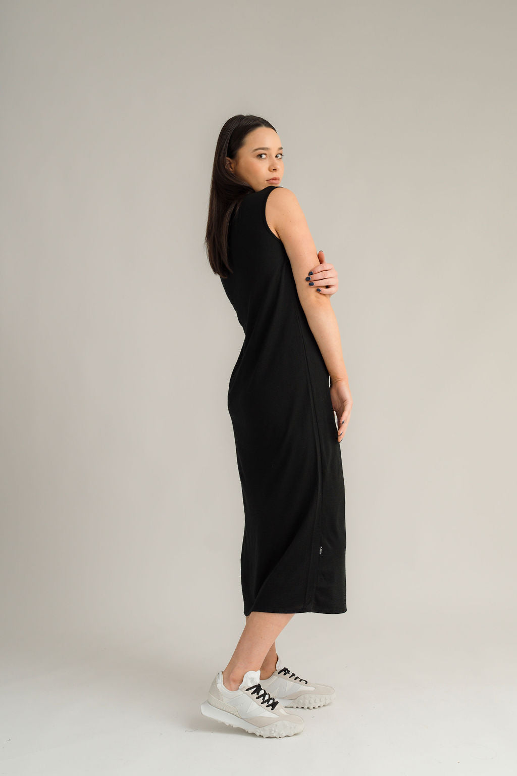 NES Merino Long Lattice Dress is your perfect companion for the cooler months. Made from soft, breathable merino wool, this versatile piece can be worn as a sleek dress or layered as a cozy base. Its relaxed fit through the body and straight hem provide a comfortable yet flattering silhouette, while fine strap detailing adds a touch of elegance. The dress is fully reversible, offering two stylish looks in one! With a length that finishes approximately 10-15cm below the knee 100% merino