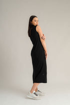 NES Merino Long Lattice Dress is your perfect companion for the cooler months. Made from soft, breathable merino wool, this versatile piece can be worn as a sleek dress or layered as a cozy base. Its relaxed fit through the body and straight hem provide a comfortable yet flattering silhouette, while fine strap detailing adds a touch of elegance. The dress is fully reversible, offering two stylish looks in one! With a length that finishes approximately 10-15cm below the knee 100% merino