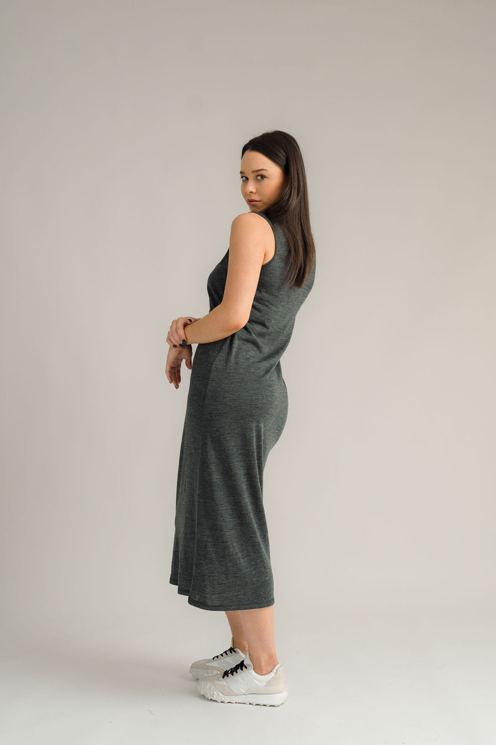 NES Merino Long Lattice Dress is your perfect companion for the cooler months. Made from soft, breathable merino wool, this versatile piece can be worn as a sleek dress or layered as a cozy base. Its relaxed fit through the body and straight hem provide a comfortable yet flattering silhouette, while fine strap detailing adds a touch of elegance. The dress is fully reversible, offering two stylish looks in one! With a length that finishes approximately 10-15cm below the knee 100% merino