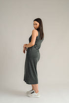 NES Merino Long Lattice Dress is your perfect companion for the cooler months. Made from soft, breathable merino wool, this versatile piece can be worn as a sleek dress or layered as a cozy base. Its relaxed fit through the body and straight hem provide a comfortable yet flattering silhouette, while fine strap detailing adds a touch of elegance. The dress is fully reversible, offering two stylish looks in one! With a length that finishes approximately 10-15cm below the knee 100% merino