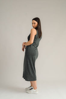 NES Merino Long Lattice Dress is your perfect companion for the cooler months. Made from soft, breathable merino wool, this versatile piece can be worn as a sleek dress or layered as a cozy base. Its relaxed fit through the body and straight hem provide a comfortable yet flattering silhouette, while fine strap detailing adds a touch of elegance. The dress is fully reversible, offering two stylish looks in one! With a length that finishes approximately 10-15cm below the knee 100% merino