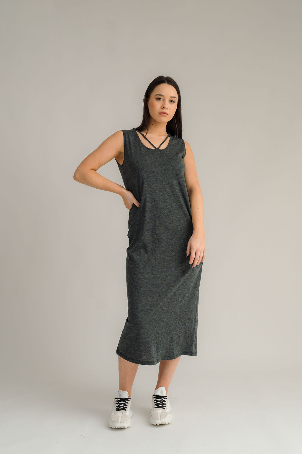 NES Merino Long Lattice Dress is your perfect companion for the cooler months. Made from soft, breathable merino wool, this versatile piece can be worn as a sleek dress or layered as a cozy base. Its relaxed fit through the body and straight hem provide a comfortable yet flattering silhouette, while fine strap detailing adds a touch of elegance. The dress is fully reversible, offering two stylish looks in one! With a length that finishes approximately 10-15cm below the knee 100% merino