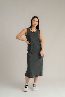 NES Merino Long Lattice Dress is your perfect companion for the cooler months. Made from soft, breathable merino wool, this versatile piece can be worn as a sleek dress or layered as a cozy base. Its relaxed fit through the body and straight hem provide a comfortable yet flattering silhouette, while fine strap detailing adds a touch of elegance. The dress is fully reversible, offering two stylish looks in one! With a length that finishes approximately 10-15cm below the knee 100% merino