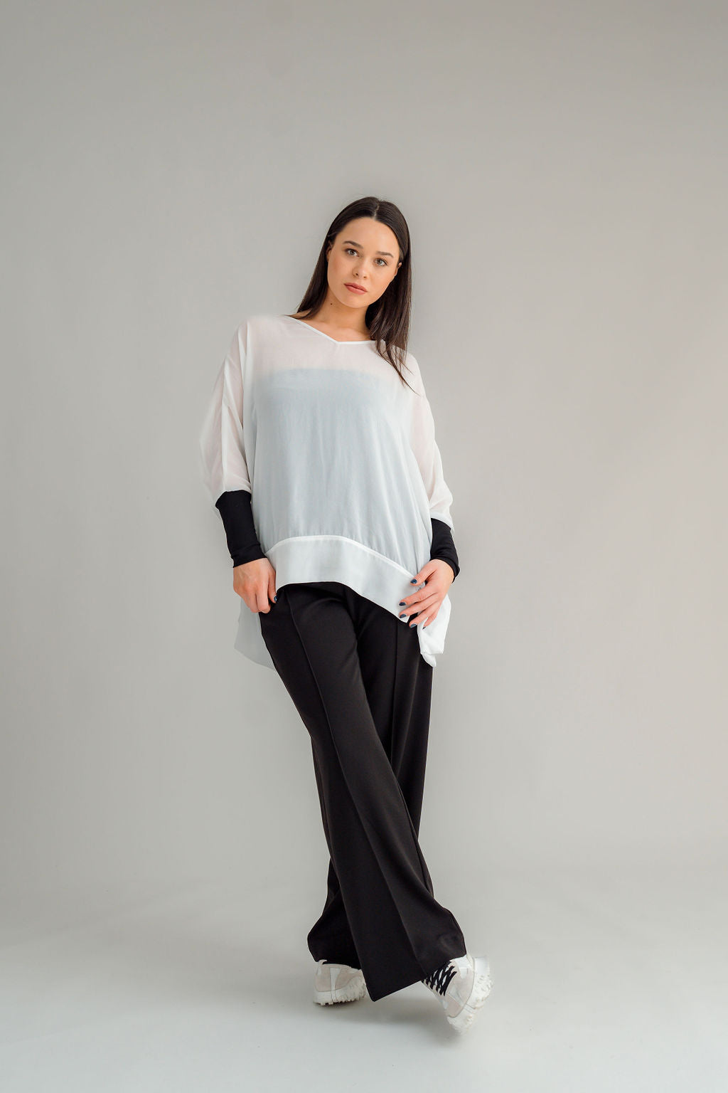 The NES Ginnie Pant is a stylish update to our top-selling Gin Pants, now featuring a pin stitch pleat down the front legs for an elongated, flattering silhouette. With a classic cut that’s easy to dress up or down, these pants are perfect for both work and everyday wear. The centre leg pin stitch detailing adds a touch of sophistication, while the flat front and covered elasticated back provide a comfortable, secure fit. The flattering angled panel at the front enhances the shape, and the full-length strai