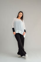The NES Ginnie Pant is a stylish update to our top-selling Gin Pants, now featuring a pin stitch pleat down the front legs for an elongated, flattering silhouette. With a classic cut that’s easy to dress up or down, these pants are perfect for both work and everyday wear. The centre leg pin stitch detailing adds a touch of sophistication, while the flat front and covered elasticated back provide a comfortable, secure fit. The flattering angled panel at the front enhances the shape, and the full-length strai
