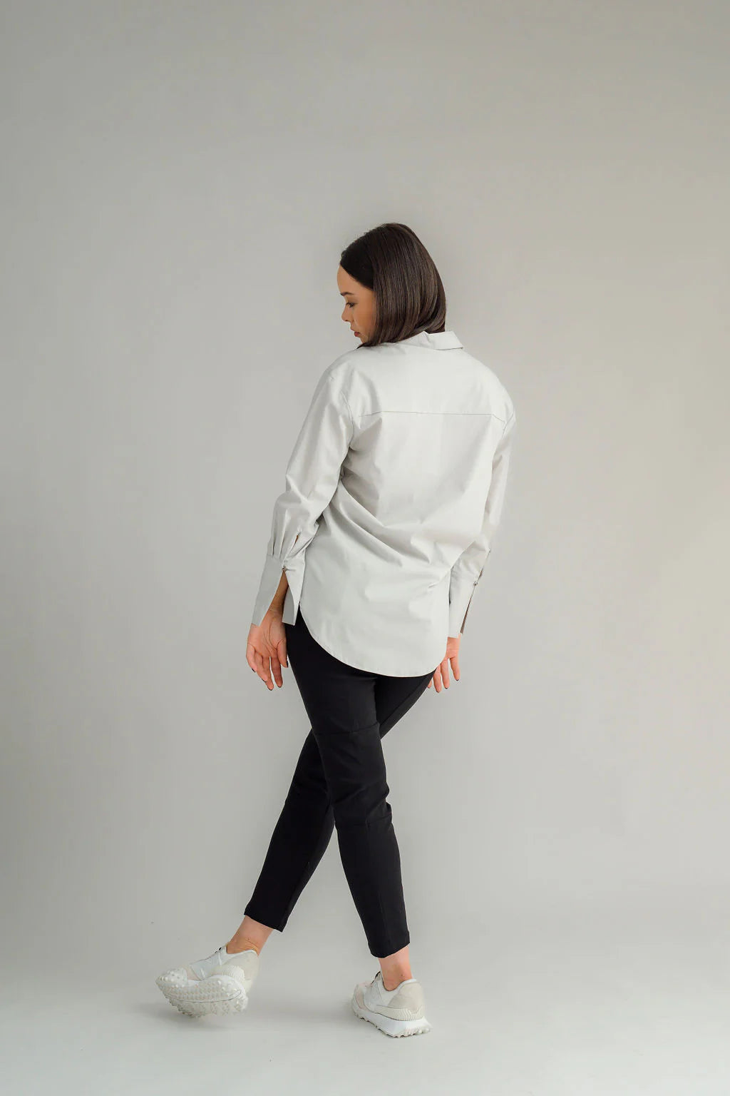 The NES Billie Shirt  long sleeves and a stretchy shirt fabric. Small metal shank buttons on the cuff and elastic loopers. cotton rayon stretch