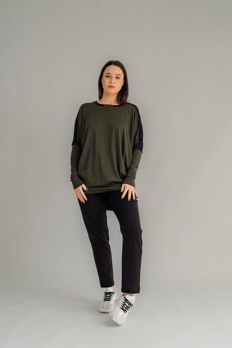 NES Harley Jumper is a stylish and versatile piece that blends comfort with contemporary design. Featuring a relaxed fit and batwing sleeves that taper into sleek cigarette cuffs, this jumper is perfect for layering or wearing on its own. Crafted from soft, high-quality merino, it pairs beautifully with your favourite NES bottoms or jeans