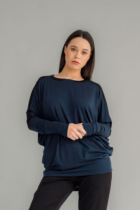 NES Harley Jumper is a stylish and versatile piece that blends comfort with contemporary design. Featuring a relaxed fit and batwing sleeves that taper into sleek cigarette cuffs, this jumper is perfect for layering or wearing on its own. Crafted from soft, high-quality merino, it pairs beautifully with your favourite NES bottoms or jeans