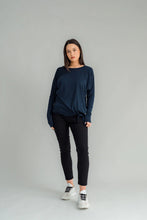 Load image into Gallery viewer, The NES Merino Leisure Tie Top is a stylish and versatile piece, perfect for pairing with your favourite denim, Dolly B pants, Drilled Gin pants, or the Ribs skirt. This top features a self-tie at the side that can be adjusted to your liking—tied tight for a more structured look or looped loose for a relaxed feel. With its batwing design and cigarette sleeves, it offers a flattering silhouette that adds slimness to your lower arms while providing maximum comfort. 100% merino
