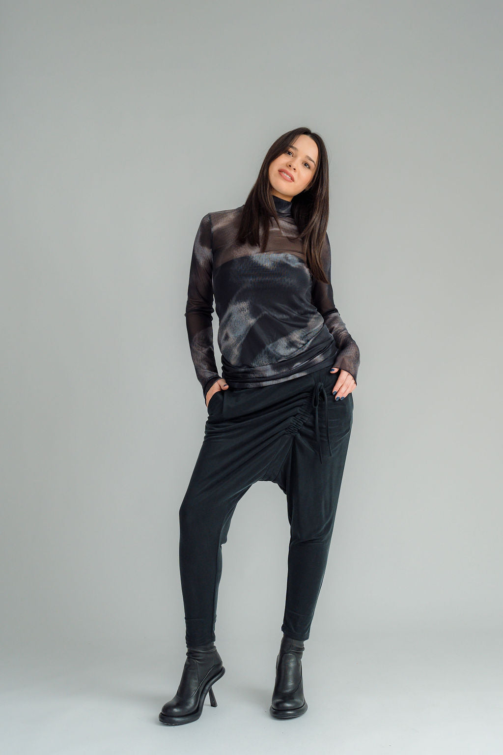 The NES Mesh Funnel Top is a must-have layering piece that adds texture and style to any outfit. Perfect for wearing over a Lattice singlet or layered under a Civita top, this versatile top can be dressed up or down with ease. We’re absolutely obsessed with the Nightscape print, which adds a touch of boldness to your look. Pair it with our new Rielly layer me or combine it with your favourite pants, like the Gin pant, Roxi pant, or Dolly B pant, for a chic and coordinated ensemble. 