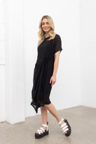 Our NES Aria Dress is a NES favourite and a must-have wardrobe piece! Featuring subtle batwing sleeves, a scoop neck, and front dart and tie detailing, this dress offers a flattering and versatile fit. The front tie can be styled tight or loose for added customization. This mid-length dress is perfect for any occasion, whether dressed up or down. We love styling the chiffon Aria Dress with our NES Lattice Slip underneath for added layering. Wear it as a standalone dress or layer it as a tunic over pants for