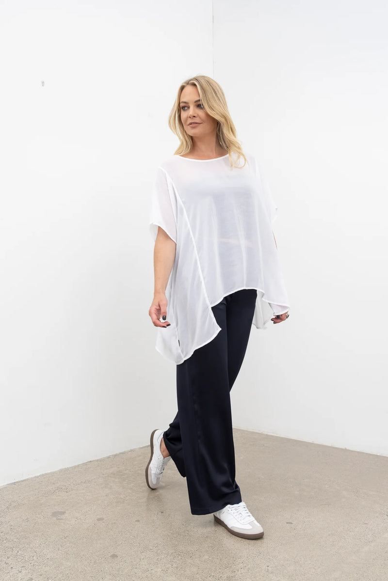 NES Civita Top – Relaxed, Flowing and Versatile

The Civita Top is an effortlessly stylish, oversized piece crafted from lightweight chiffon. Featuring contrast piping along the front vertical seam and split side detailing, this top offers multiple styling options. Tie the sides for a more defined silhouette or tuck it in for a relaxed, easy-going look. Perfect for layering or wearing solo, it transitions seamlessly from day to night, making it ideal for any season. PT CHIFFON nes lattice singlet