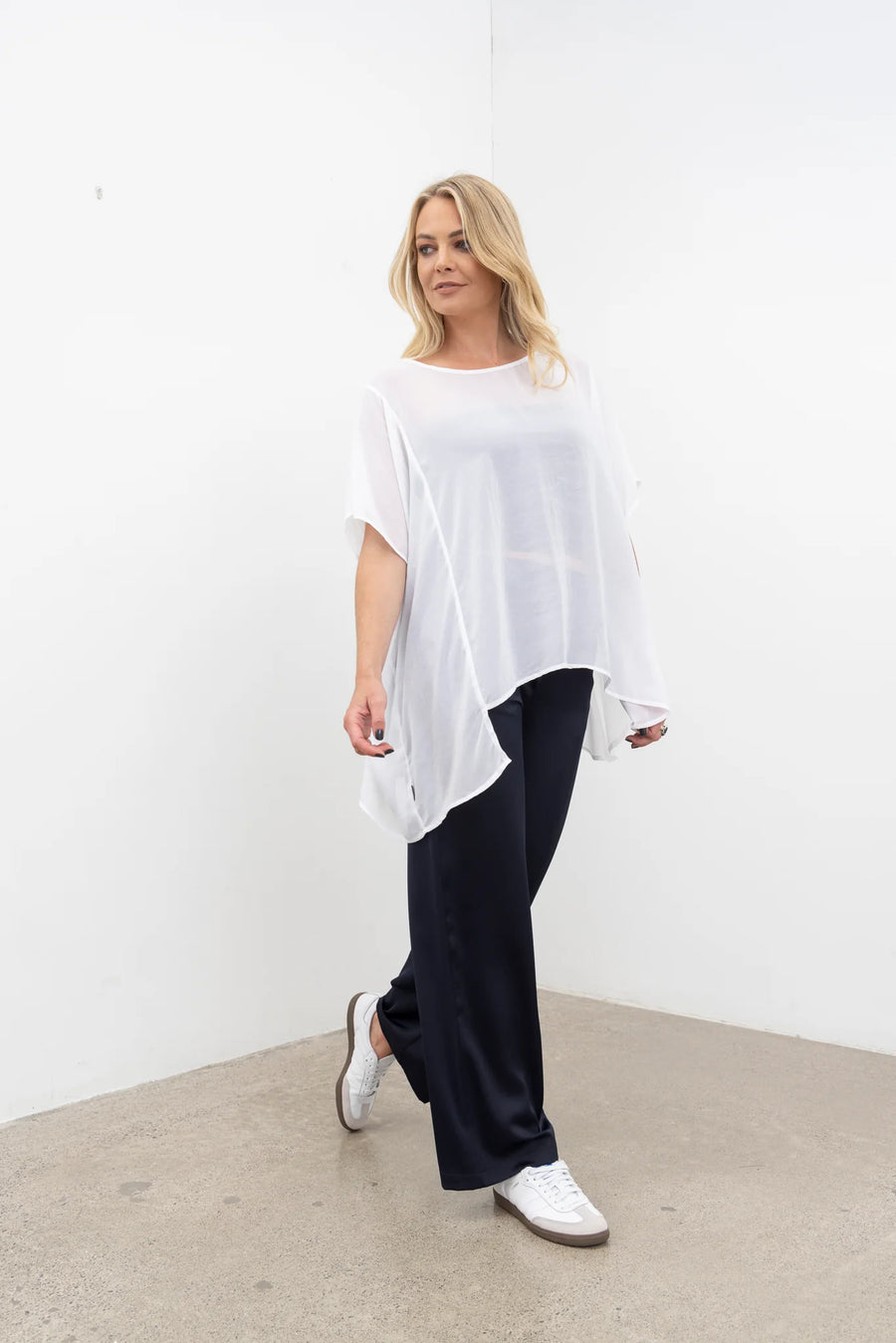 NES Civita Top – Relaxed, Flowing and Versatile

The Civita Top is an effortlessly stylish, oversized piece crafted from lightweight chiffon. Featuring contrast piping along the front vertical seam and split side detailing, this top offers multiple styling options. Tie the sides for a more defined silhouette or tuck it in for a relaxed, easy-going look. Perfect for layering or wearing solo, it transitions seamlessly from day to night, making it ideal for any season. PT CHIFFON nes lattice singlet