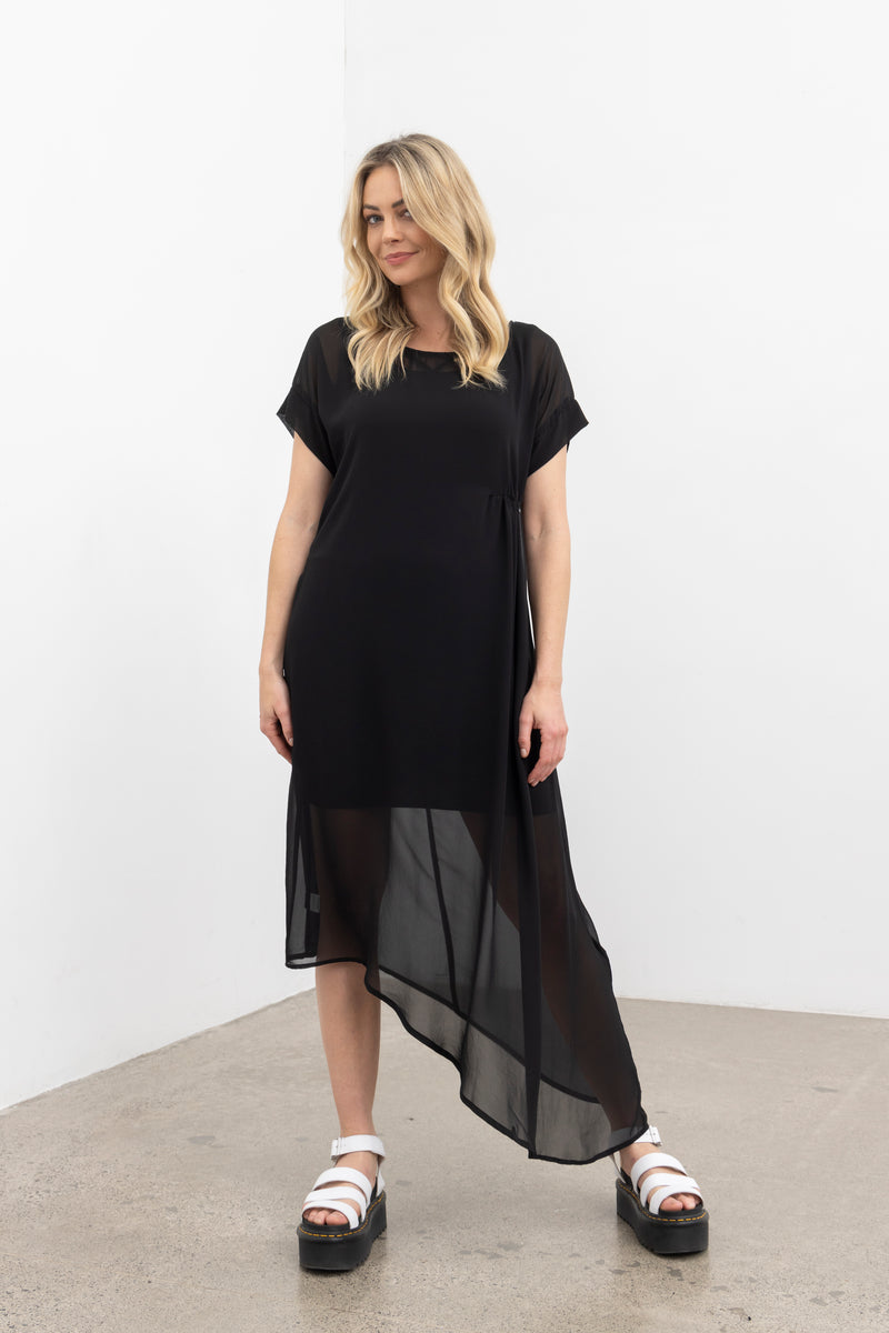The NES Flow Dress is a multi-seasonal, versatile style that seamlessly transitions from casual to formal occasions. This dress offers a variety of styling options—wear it draped down across the front for a relaxed look, or cinch it up at the side using the adjustable side button and hem loopers for a more structured appearance. The perfect balance of comfort and elegance, this dress can be styled with our Lattice Slip