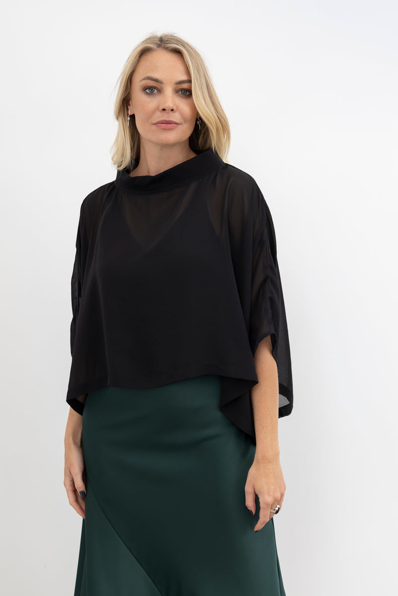 Elevate your wardrobe style with the NES Kio Top, a playful twist on our best-selling Bioko Top. Featuring a chic tube neck, stitched-in armholes, and a stylish high-low hem, Kio is the ultimate wardrobe must-have. Perfect for adding instant style and coverage, Kio layers effortlessly over any tank-style top or dress. Whether dressing up or down, the NES Kio Top combines versatility with fashion flair, making it a go-to piece for any occasion. A must-have addition to your collection for effortless sophistic