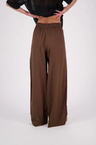 The N-E-S Rita Pant is a full-length take on our bestselling short, crafted in a breathable linen-cotton blend with a relaxed silhouette and subtle front leg pleat. Featuring angled front pockets, a flat front with a decorative drawcord, and an elasticated back waistband for all-day ease. The white colourway includes a half lining in soft cotton voile for added coverage and comfort.

Our model is 174cm and wears a XS (8)

Composition: Linen Cotton

Designed and Made in New Zealand