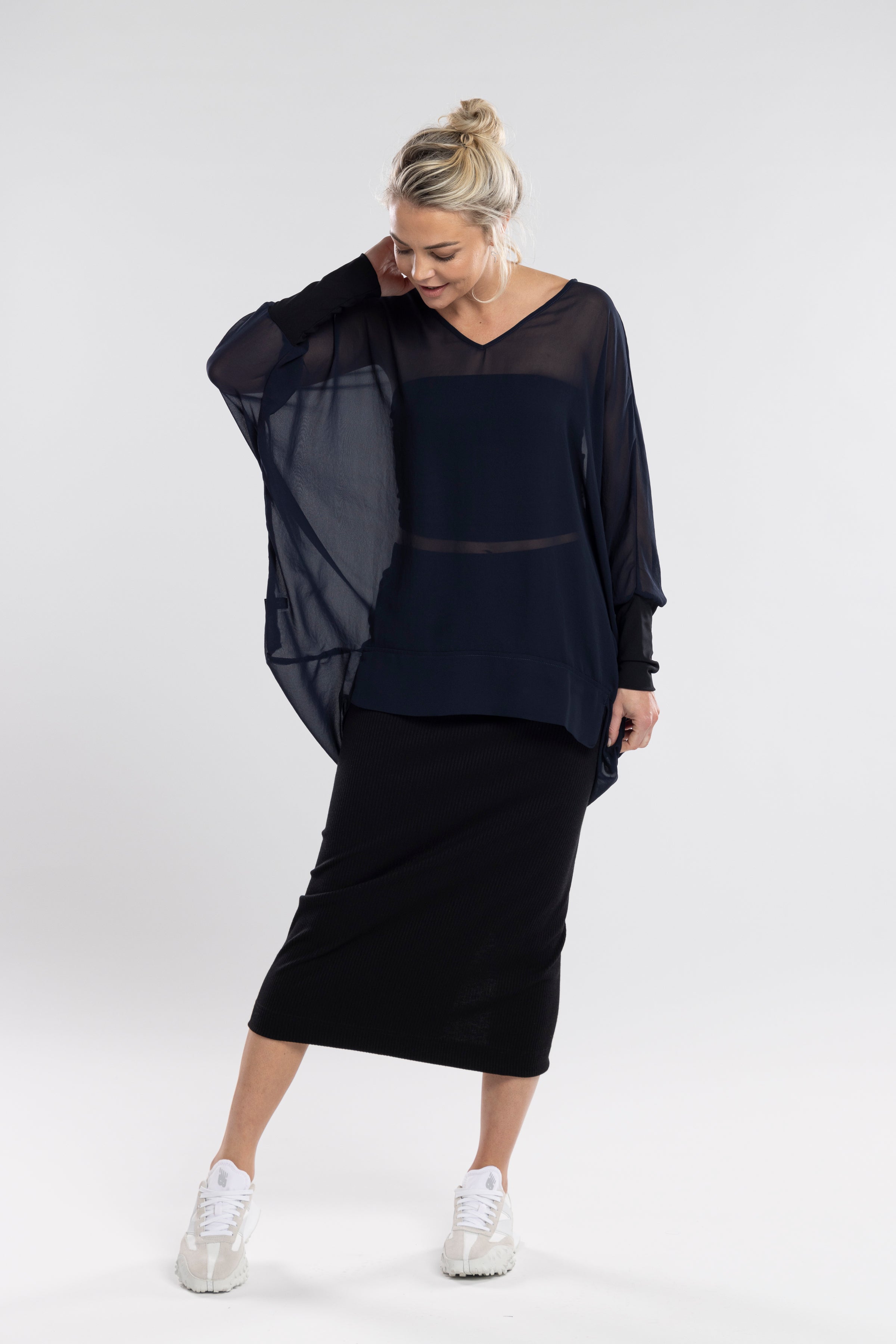 The NES Ribs Skirt is an effortless style meets all-day comfort in a skirt. Designed to gently skim the body without clinging, it features a soft elasticated waistband, centre back seam, and split for easy movement. The ribbed polyester/spandex blend offers the perfect balance of stretch and structure — making it an easy go-to for everyday wear or elevated layering.