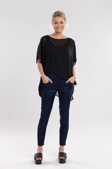 The Satin Section Pant is your go-to slightly more dressy NES essential, offering effortless style and unmatched comfort. With fabulous spliced detailing, this pant combines a sleek flat front with an elasticated back for the perfect fit. Side pockets provide practicality, while the 7/8 length and satin finish add an elevated touch to your look. Whether you're dressing up for a night out, office wear, or a special occasion, these versatile pants can easily be styled for any event. 
