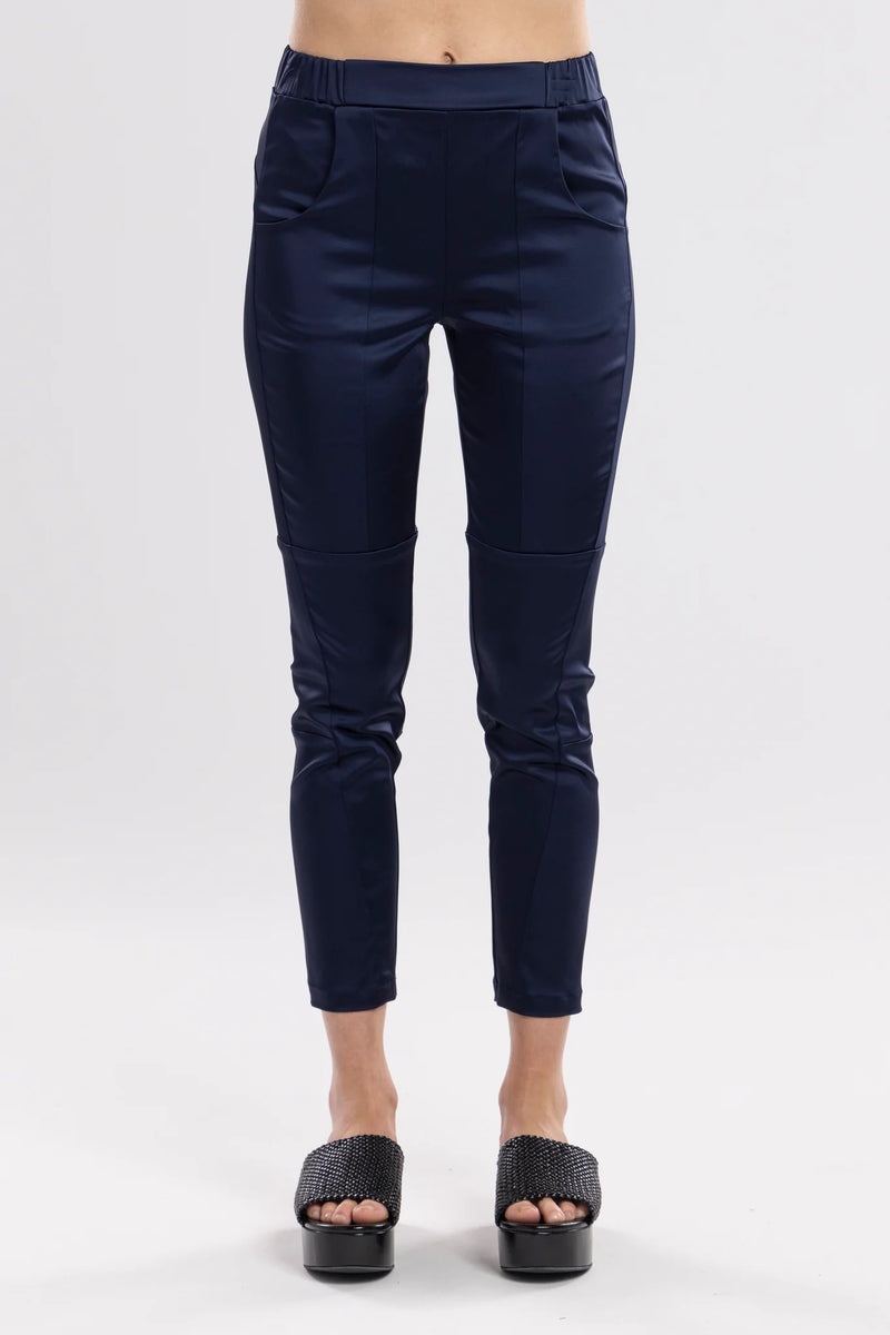 The Satin Section Pant is your go-to slightly more dressy NES essential, offering effortless style and unmatched comfort. With fabulous spliced detailing, this pant combines a sleek flat front with an elasticated back for the perfect fit. Side pockets provide practicality, while the 7/8 length and satin finish add an elevated touch to your look. Whether you're dressing up for a night out, office wear, or a special occasion, these versatile pants can easily be styled for any event. 