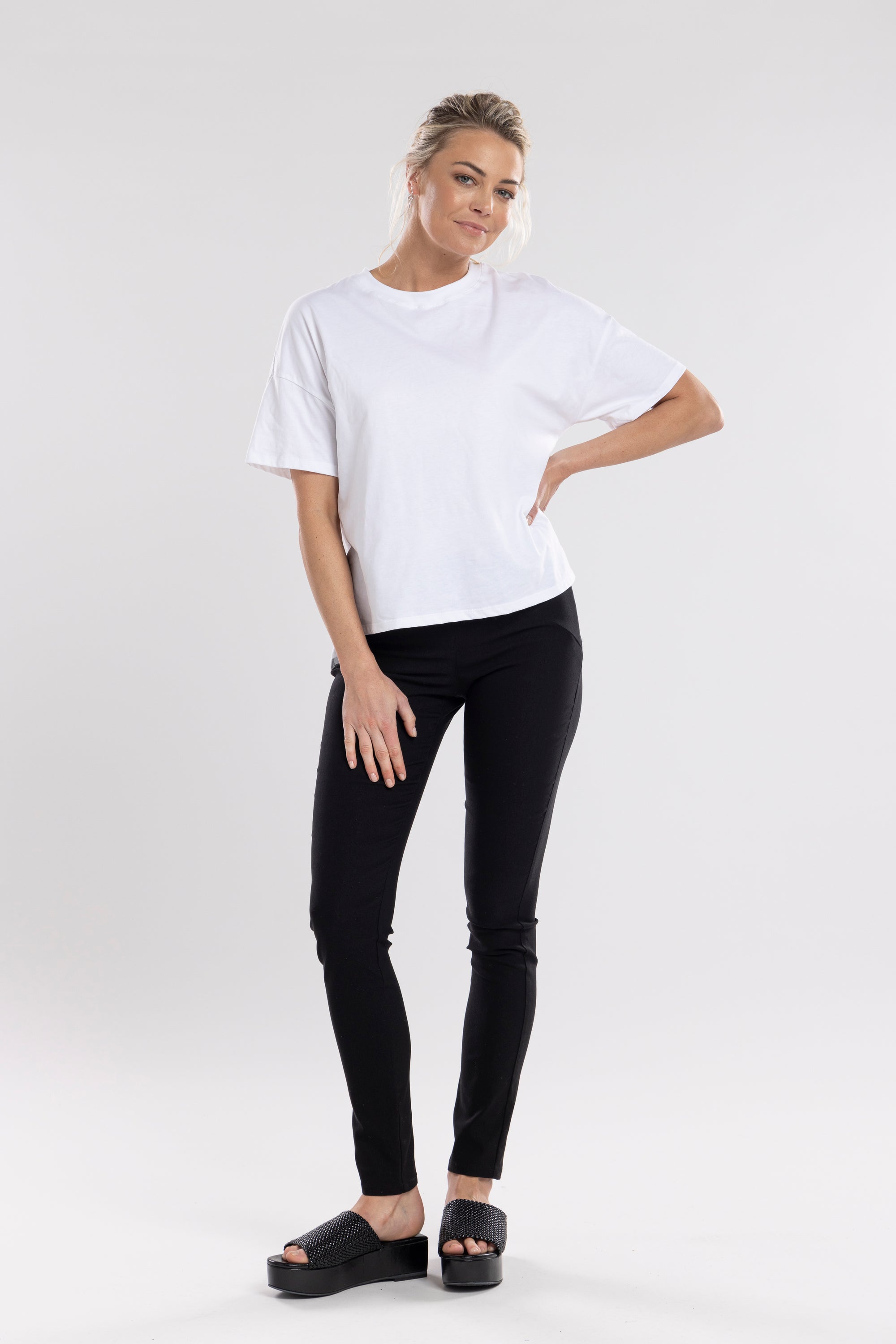 The NES Skinnie Minnies Pant is your go-to for sleek, everyday style with a modern edge. Crafted from the same super stretchy twill fabric you love, these pants are all about a flattering fit and effortless comfort. Featuring a cigarette-style slim leg, flat waistband, and a concealed side seam zip, the Skinnie Minnies offer a streamlined silhouette that's both polished and wearable.
