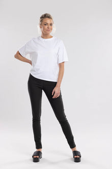 The NES Skinnie Minnies Pant is your go-to for sleek, everyday style with a modern edge. Crafted from the same super stretchy twill fabric you love, these pants are all about a flattering fit and effortless comfort. Featuring a cigarette-style slim leg, flat waistband, and a concealed side seam zip, the Skinnie Minnies offer a streamlined silhouette that's both polished and wearable.