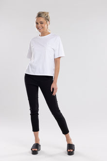 NES Section Pant is the perfect blend of style and comfort, featuring fabulous spliced detailing that adds a modern edge to your look. With a sleek flat front and an elasticated back, these pants offer a comfortable and flattering fit. Practical side pockets enhance the design, while the length finishes just above the ankle, creating a chic, tailored silhouette. Ideal for both casual and dressier occasions