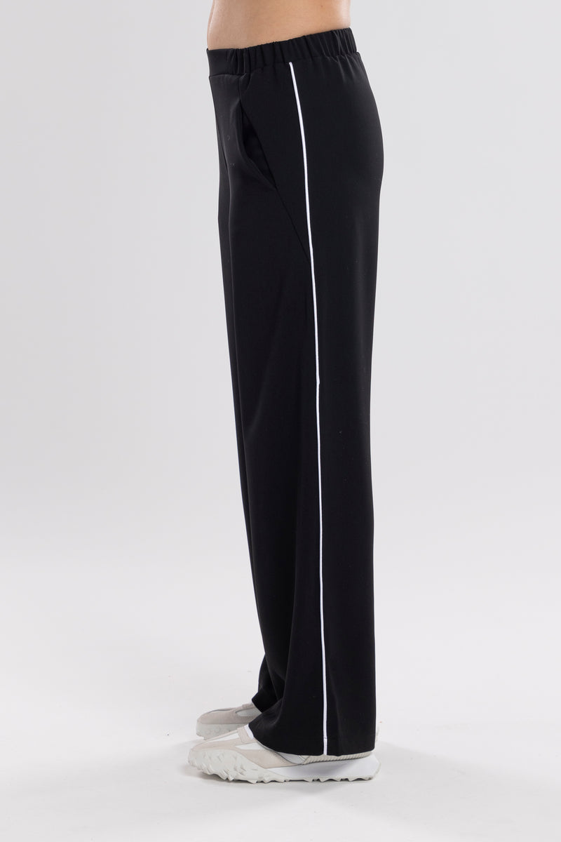 NES Piped Gin Pant - Black/White.  contrast side seam piping detail. feature a flattering, classic cut. ideal work pant and an effortless everyday style. With a flat front, covered elasticated back, and flattering angled pockets. Made from an easy-wearing poly fabric that’s floaty, cool to the touch