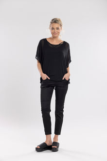 The Satin Section Pant is your go-to slightly more dressy NES essential, offering effortless style and unmatched comfort. With fabulous spliced detailing, this pant combines a sleek flat front with an elasticated back for the perfect fit. Side pockets provide practicality, while the 7/8 length and satin finish add an elevated touch to your look. Whether you're dressing up for a night out, office wear, or a special occasion, these versatile pants can easily be styled for any event. Elegant, stylish, and desi