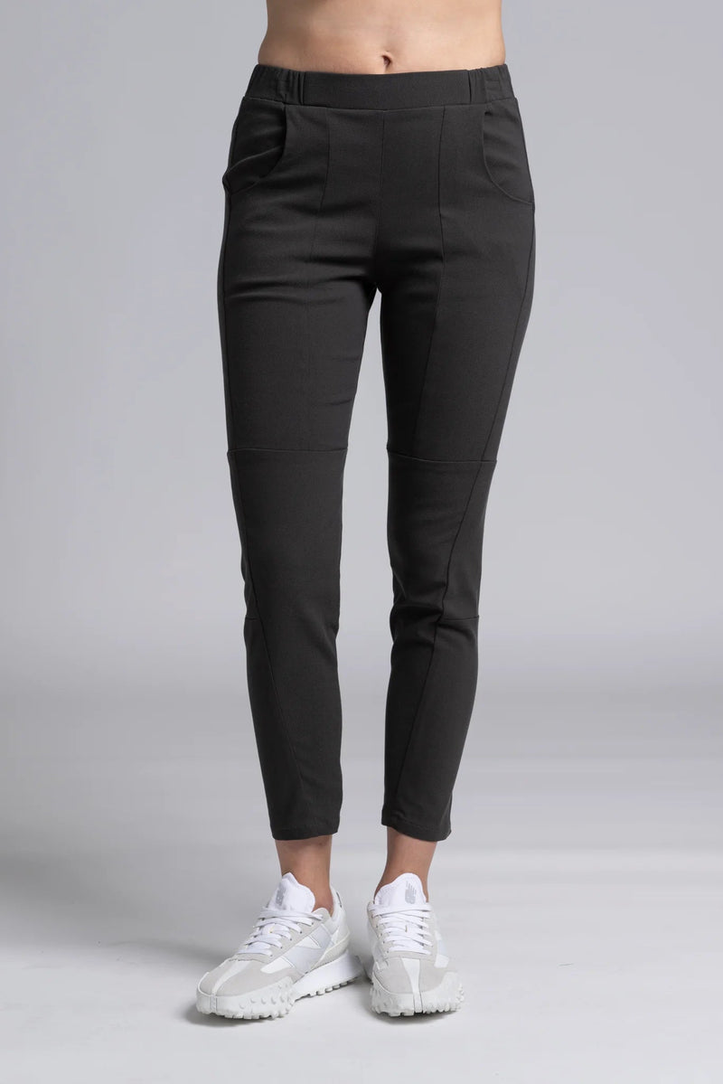 NES Section Pant is the perfect blend of style and comfort, featuring fabulous spliced detailing that adds a modern edge to your look. With a sleek flat front and an elasticated back, these pants offer a comfortable and flattering fit. Practical side pockets enhance the design, while the length finishes just above the ankle, creating a chic, tailored silhouette. Ideal for both casual and dressier occasions