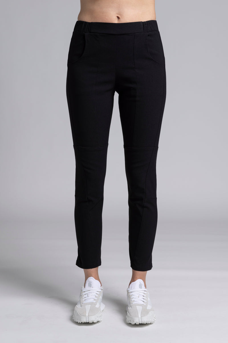 NES Section Pant is the perfect blend of style and comfort, featuring fabulous spliced detailing that adds a modern edge to your look. With a sleek flat front and an elasticated back, these pants offer a comfortable and flattering fit. Practical side pockets enhance the design, while the length finishes just above the ankle, creating a chic, tailored silhouette. Ideal for both casual and dressier occasions