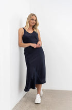 Vslip Dress is a great versatle style to have in your wardrobe. This style can be worn as a slip or a dress.

Tank style straps - cover a bra or if no bra is worn the front facing provides good coverage.

Back strap detailing - button and button holes. Allow the straps to be easily adjusted and crossed over to create a criss X back.

Cut on the bias this dress is figure hugging.

to dress the Vslip as a slip - layer the Civita dress or flow dress over the top to create texture and layering to your fav NES d