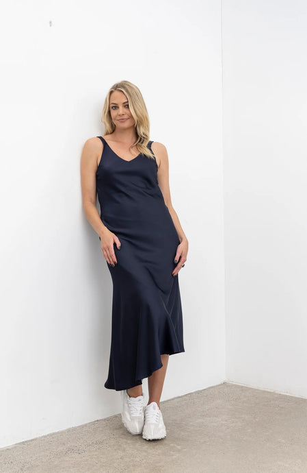 Vslip Dress is a great versatle style to have in your wardrobe. This style can be worn as a slip or a dress.

Tank style straps - cover a bra or if no bra is worn the front facing provides good coverage.

Back strap detailing - button and button holes. Allow the straps to be easily adjusted and crossed over to create a criss X back.

Cut on the bias this dress is figure hugging.

to dress the Vslip as a slip - layer the Civita dress or flow dress over the top to create texture and layering to your fav NES d