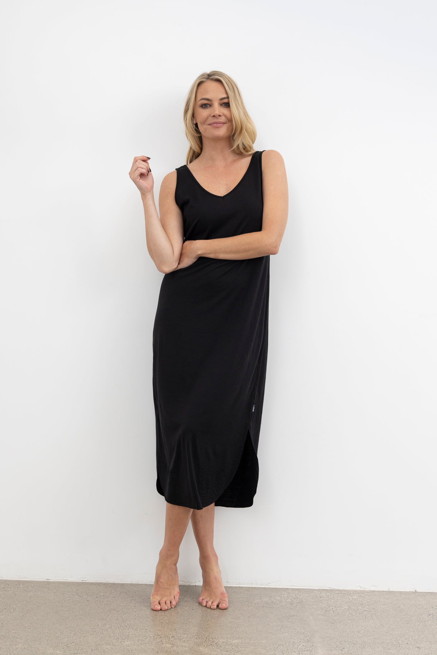 The NES Reversible Lattice Merino Slip is a&nbsp;layering essential with a clever twist — the Reversible Lattice Merino Slip offers two looks in one with its versatile design. Made from soft, breathable merino in our signature lattice knit, it's perfect for wearing under sheer styles or on its own as a luxe lounge piece. The slim fit sits comfortably against the body, providing warmth without bulk, and transitions seamlessly across seasons.