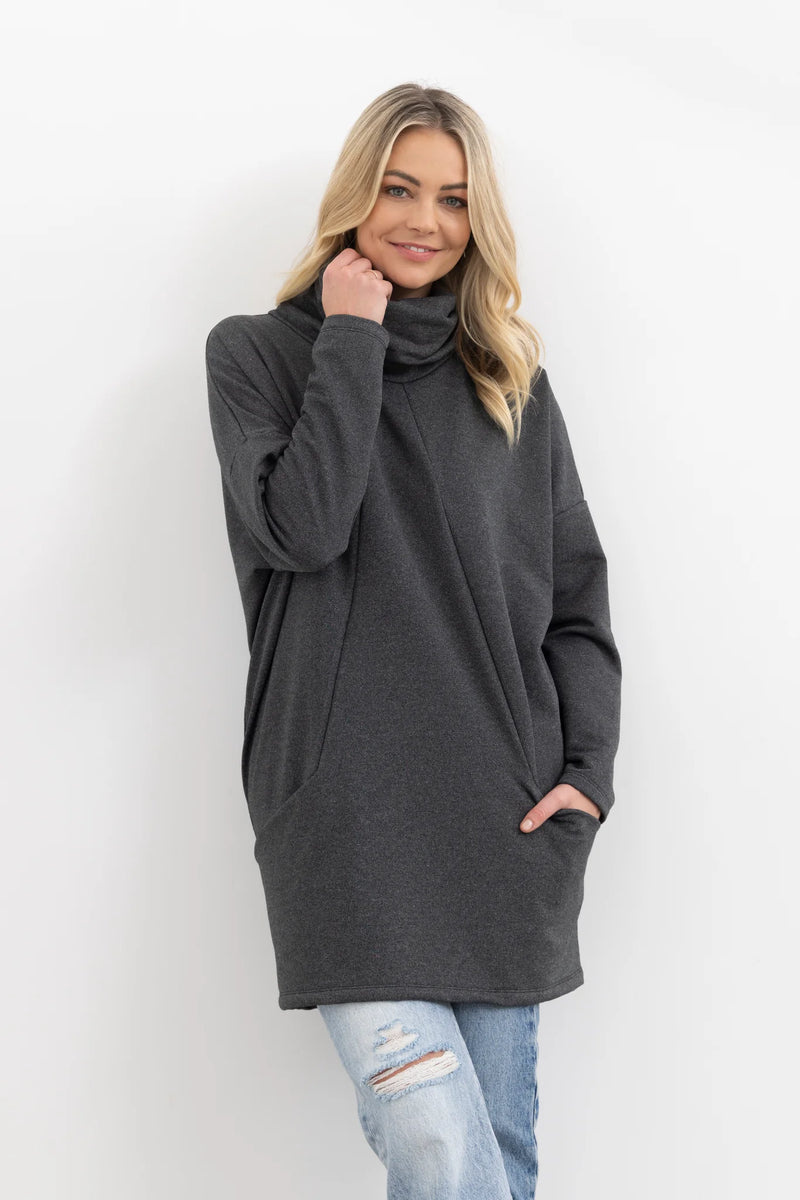 The Rebellious Jumper keeps you cozy with a scrumptious oversized funnel neck collar to snuggle around your neck.

Front pockets and zip-up back.

Can be worn zipped or open for your casual weekend look.

Composition: 100% merino jersey