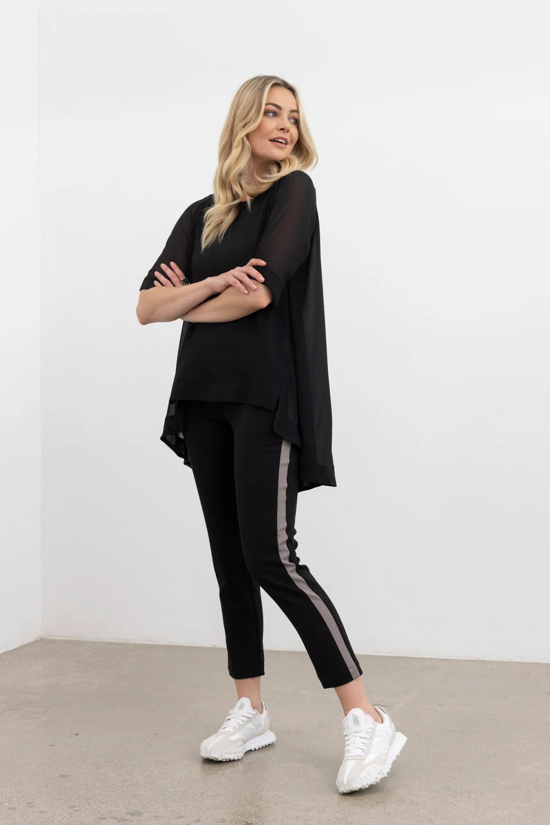 The NES Lilly Pant is a fresh new style designed for both comfort and impact. Featuring a sleek straight leg in a flattering 7/8 length, this pant is elevated with a bold racer-style contrast stripe along the side seam. Thoughtfully detailed with a curved back yoke, faux front fly, and side seam pockets, the Lilly Pant combines structure with everyday ease. The elasticated waistband and soft 2-way stretch fabric ensure a comfortable, flexible fit, making it an effortlessly versatile piece