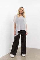The NES Ginnie Pant is a stylish update to our top-selling Gin Pants, now featuring a pin stitch pleat down the front legs for an elongated, flattering silhouette. With a classic cut that’s easy to dress up or down, these pants are perfect for both work and everyday wear. The centre leg pin stitch detailing adds a touch of sophistication, while the flat front and covered elasticated back provide a comfortable, secure fit. The flattering angled panel at the front enhances the shape, and the full-length strai