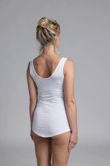 The NES Lattice Singlet is a must-have essential for every wardrobe. Crafted from a soft, stretchy knit that's not see-through, this versatile piece can be worn as an undergarment for smooth layering or styled as a top for a chic, minimalist look. Featuring fine lattice strap detailing and a reversible design, you get two stylish options in one.