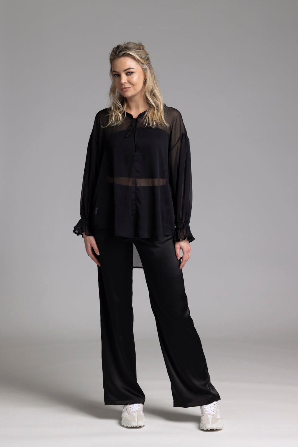 The NES Satin Gin Pants are our absolute top-selling dressy essential pants, designed to flatter all body shapes. Featuring a classic cut, these versatile pants are perfect for both dressing up and down, making them an ideal choice for an evening out or as a chic, dressed-up everyday look. The flat front, covered elasticated back, and flattering angled pockets provide both comfort and sophistication. Crafted from a floaty, cool-to-the-touch poly satin fabric that’s anti-crease