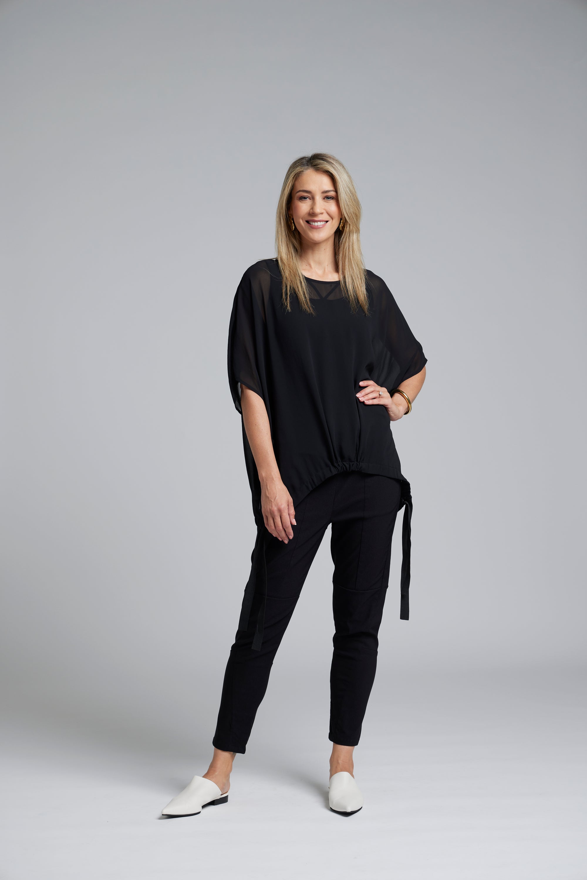 The N-E-S Section Pant – a sleek ankle-length stretch pant with panel detailing, flat front and elastic back. Available in Black, Artillery and Ink. NZ made.